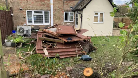 BBC Debris in a garden after a storm
