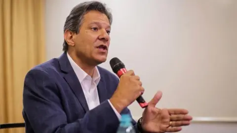 AFP Fernando Haddad speaks at a news conference