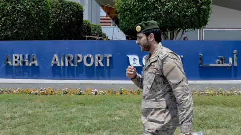 AFP File photo showing Saudi military officer outside Abha airport on 13 June 2019