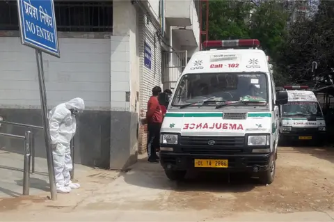 Getty Images A doctor seen wearing protective suit to protect himself form coronavirus epidemic in the country, at RML Hospital on March 16, 2020 in New Delhi, India