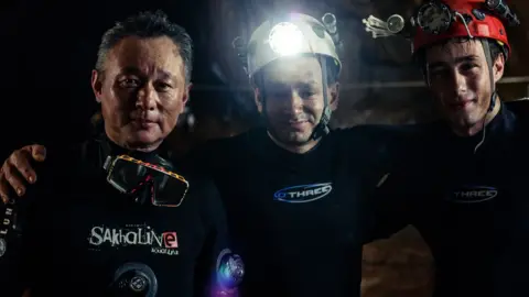 Fredrik Divall/De Warrenne Pictures Cave divers Tan Xiaolong, Jim Warny and actor Alex Winslow on the set of The Cave