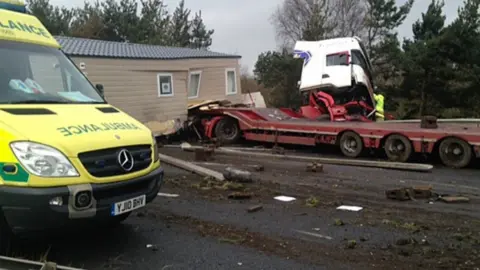 PA Media The scene of the crash