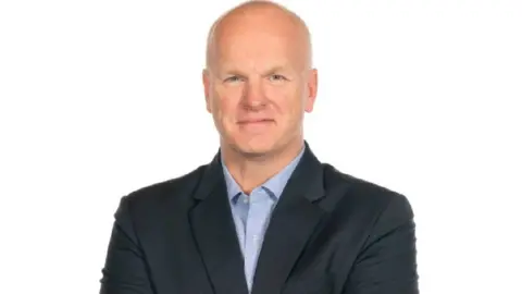 Agratas a man in a suit