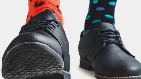 Sviatlana Barchan/Getty Images Brightly-coloured socks