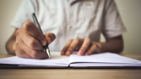 iStock Student writing