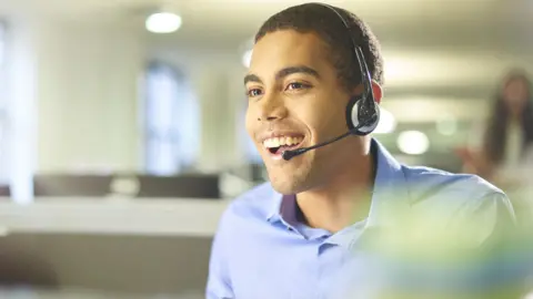 Getty Images Man working in a call centre