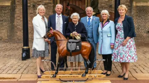 The Queen being presented with a rocking horse for her Platinum Jubilee