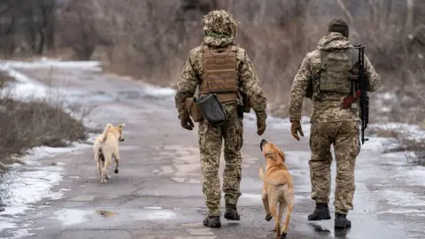 Getty Images Ukrainian paratroopers are seen stationed on the frontline near Stanytsia Luhanska, Luhansk Region, Ukraine on January 21