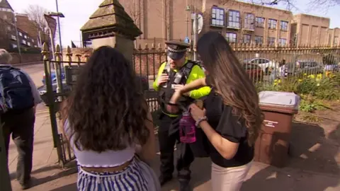 Police checking people's bags for alcohol