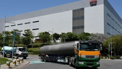 AFP Water trucks arrive at TSMC factory in Taichung, central Taiwan