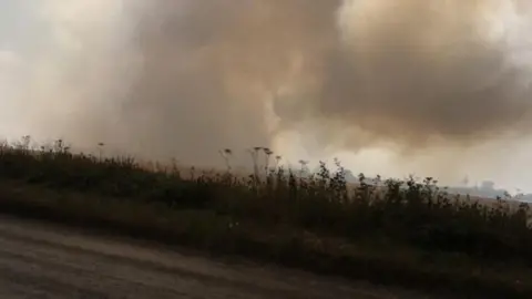 Fire outside entrance of Wroxham Barns