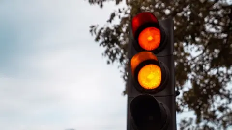 Traffic light changing from amber to red