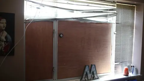 Lewisham Council A damaged window in an shared house in Lewisham