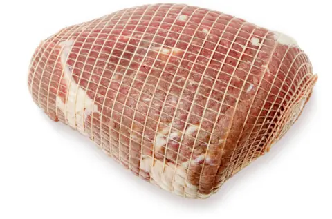 Getty Images An uncooked roast beef in string netting