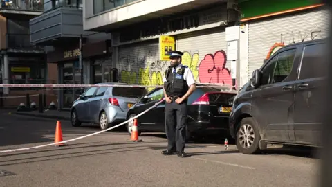 Police officer near police tape