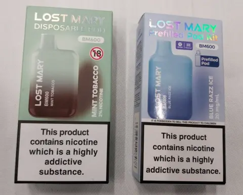 A boxed Lost Mary disposable vape, next to a boxed Lost Mary prefilled vape, which looks almost identical