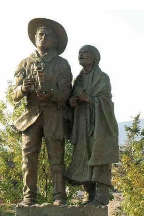 Thompson family photo A statue of David Thompson and his wife Charlotte. David is holding a sextant and Charlotte is wearing a large shawl. They are both looking skywards.