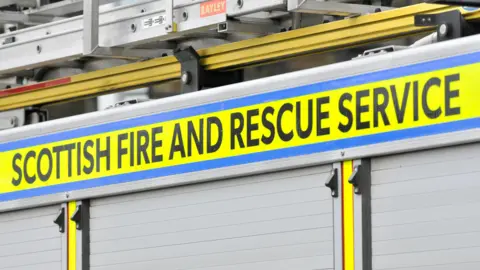 Getty Images The side of a fire engine with the Scottish and Fire Service logo on it