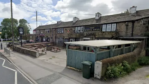 View of the White Swan pub in Wibsey from the road