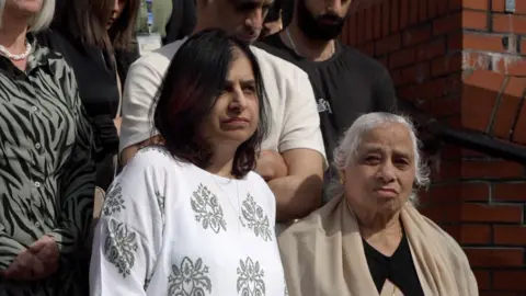 BBC Susan Kohli and Bhim's partner on the steps of Leicester Crown Court