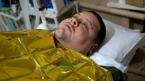 BBC/Lee Durant Viktor pictured on a hospital bed at the stabilisation point.