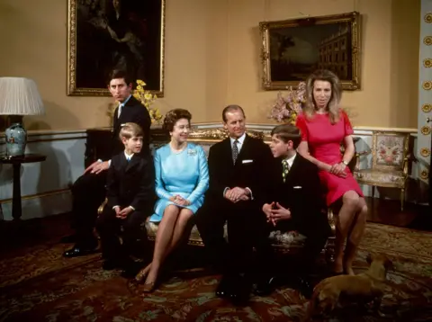 Fox Photos/Hulton Archive/Getty Images The royal family at Buckingham Palace, London, 1972. Left to right: Princess Anne, Prince Andrew, Prince Philip, Queen Elizabeth, Prince Edward and Prince Charles.