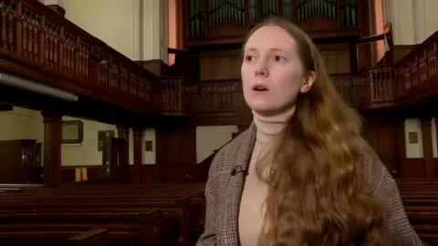 Laura stands in Carmarthen's Penuel Chapel