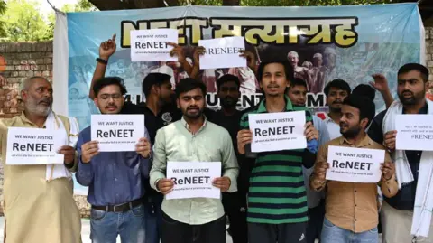 Getty Images NEET exam candidates and their parents protest against cancellation of Neet Re-Exam at Jantar Mantar on June 12, 2024 in Delhi
