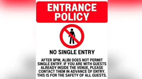 Alibi/Instagram Red white and black sign designed like a road sign saying no single entry into the Alibi venue.