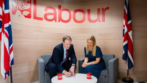 Dan Poulter with Ellie Reeves signing a Labour membership form