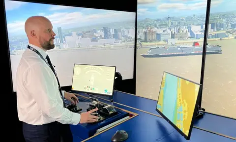 River pilot James Smart at his computer simulation of the River Mersey