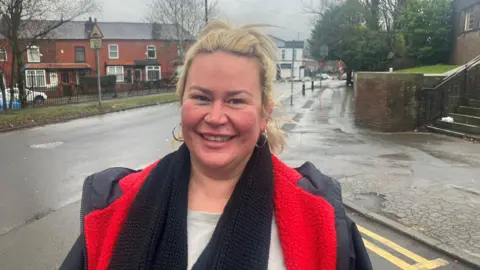 Photograph of Julie Ashton from Astley Bridge. She is pictured on a road in the Breightmet area of the town. 