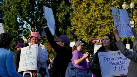 Reuters Image shows protesters outside the Supreme Court on Wednesday