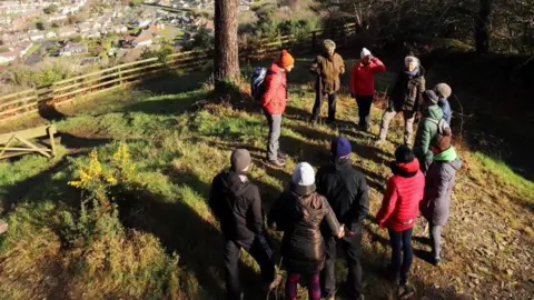 Graham Makepeace-Warne A community mindfulness event held at MWT Hairpin Woodland Park with views over Ramsey