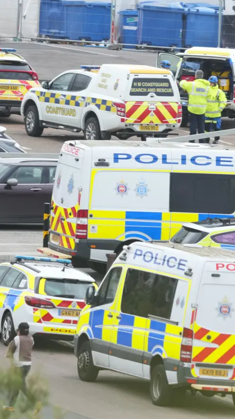 Police vehicles parked near each other. 