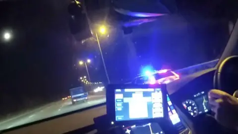 Dashcam footage shows a police car pushing a van.