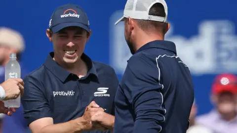 Matt Fitzpatrick and his brother Alex Fitzpatrick share a fist bump at the Zurich Classic of New Orleans