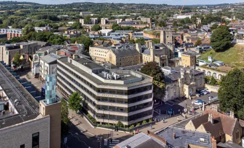 A bird's eye view of the County Hall building and other sites in Oxford around it.