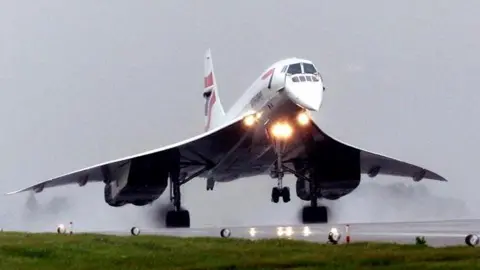 PA Concorde taking off from a runway