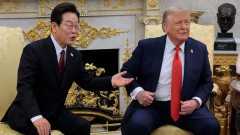 Getty Images US President Donald Trump (R) and South Korean President Lee Jae-myung talk to reporters before an Oval Office meeting at the White House on August 25, 2025 in Washington, DC.