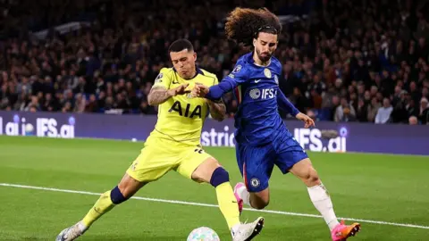 Marc Cucurella and Pedro Porro battle for the ball