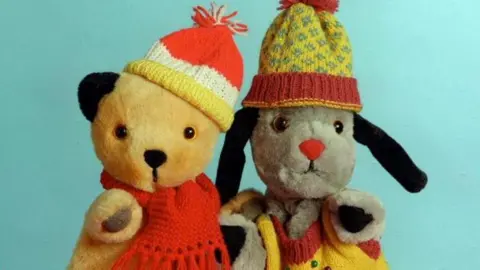 PA Media Sooty (left) and Sweep (right) 