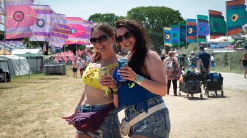 Two women arrive at the Isle of Wight Festival