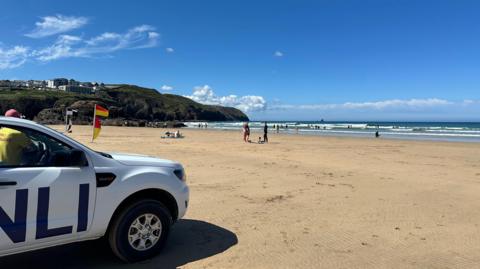 A lifeguard's vehicle parked on Perranporth beach