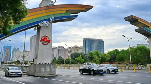 Getty Images A themed installation is set up on a rainbow-shaped gate on Chang'an Avenue
