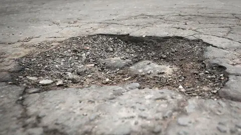 PA Media Close up image of a pothole