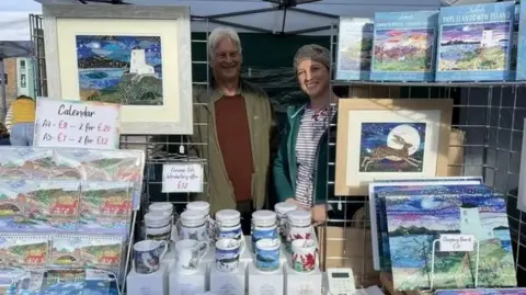 Josie Russell Shaun Russell stood with his daughter Josie at a stall selling her art works. 