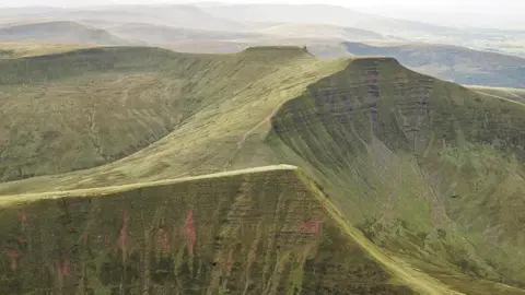 Getty Images Aerial shot of Pen y Fan, Corn Du and Cribyn mountains in Bannau Brycheiniog, also known as the Brecon Beacons