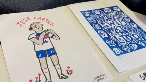 Miriam Pritchard illustrations of Lioness Jess Carter and a white and blue poster reading I swim at the lido, surrounded by people's heads.