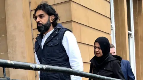 Omer and Attiya Sheikh walking into court ahead of sentencing